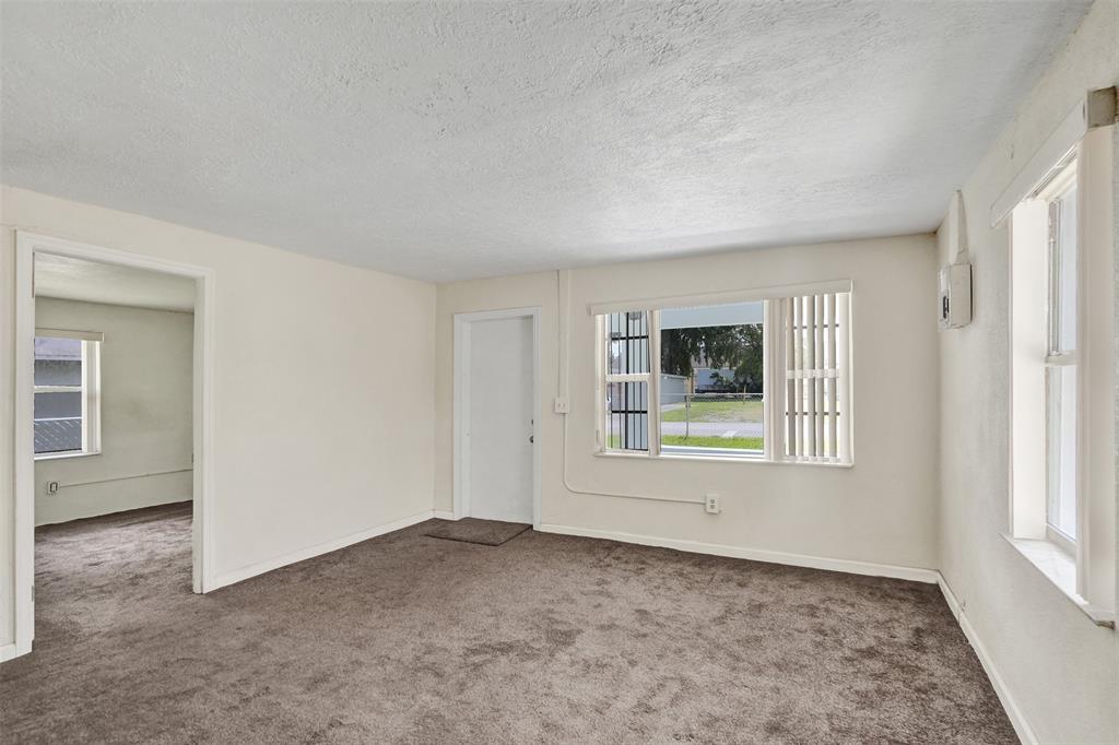 2055 Northwest 8th Street Pompano Beach, FL 33069 - Photo 4 of 20 an empty room with windows