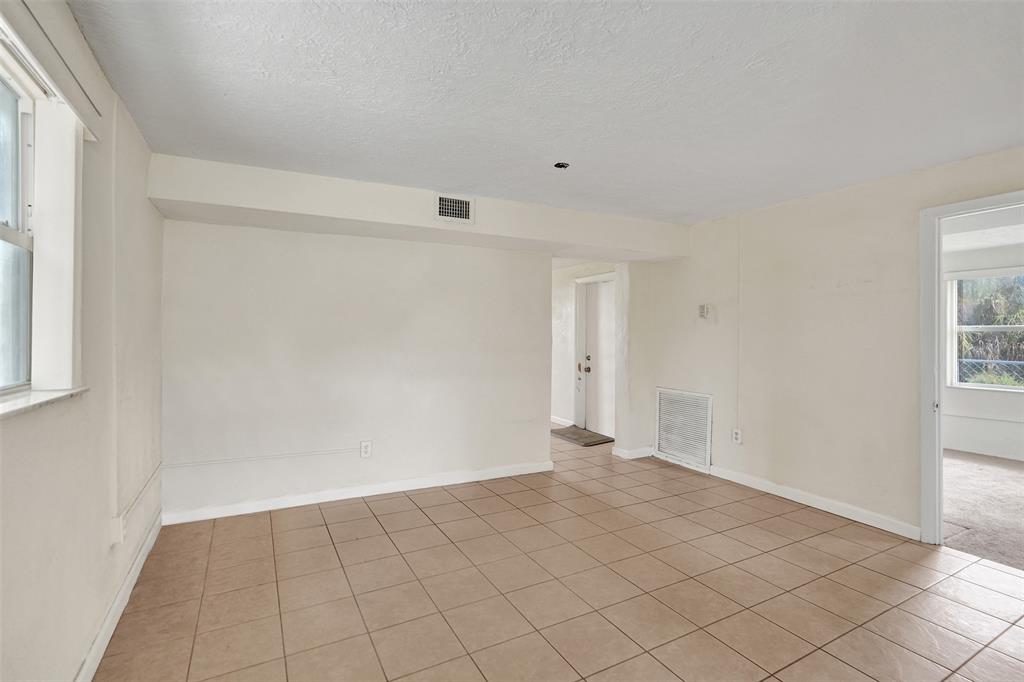 2055 Northwest 8th Street Pompano Beach, FL 33069 - Photo 5 of 20 a view of an empty room and window