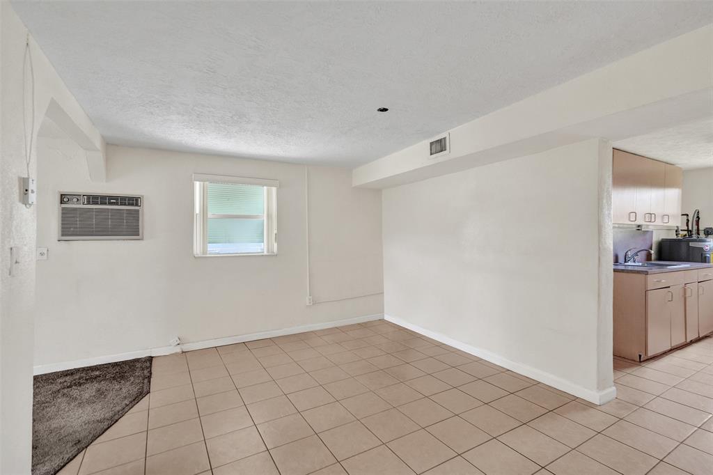 2055 Northwest 8th Street Pompano Beach, FL 33069 - Photo 6 of 20 a view of an empty room with window