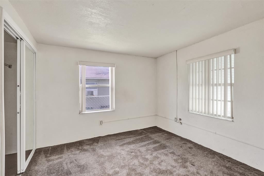 2055 Northwest 8th Street Pompano Beach, FL 33069 - Photo 9 of 20 an empty room with a window