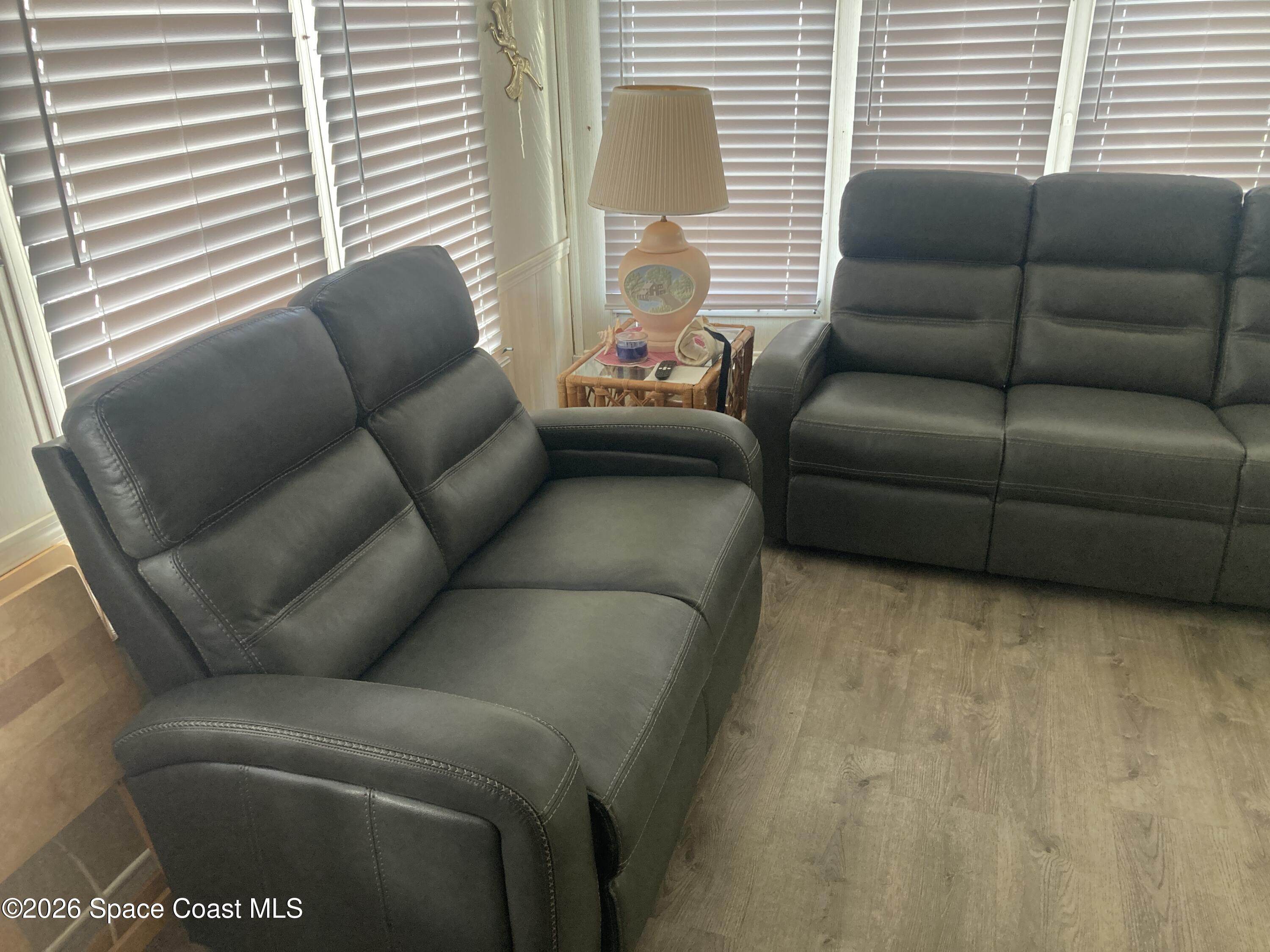 283 Buffalo Place Rockledge, FL 32955 - Photo 10 of 23 a living room with furniture and a window