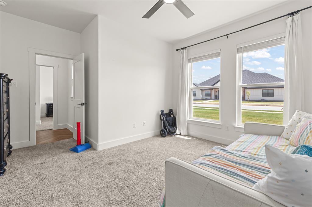 120 Long Ranger Road Abilene, TX 79602 - Photo 18 of 23 Front bedroom with fan and large windows