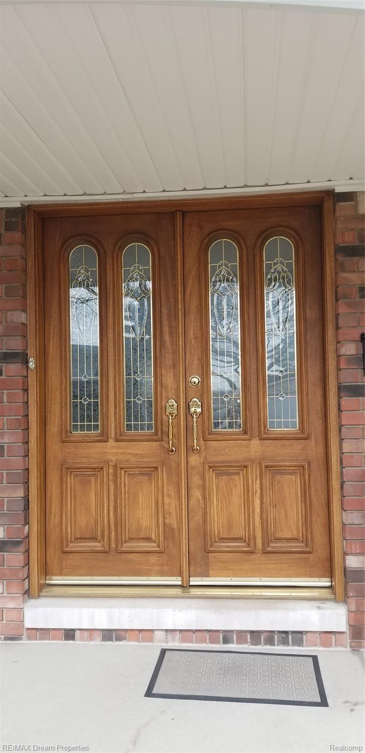 6533 Flintlock Ridge Utica, MI 48317 - Photo 2 of 53 NEWER CUSTOM DOUBLE MAHOGANY ENTRY DOOR