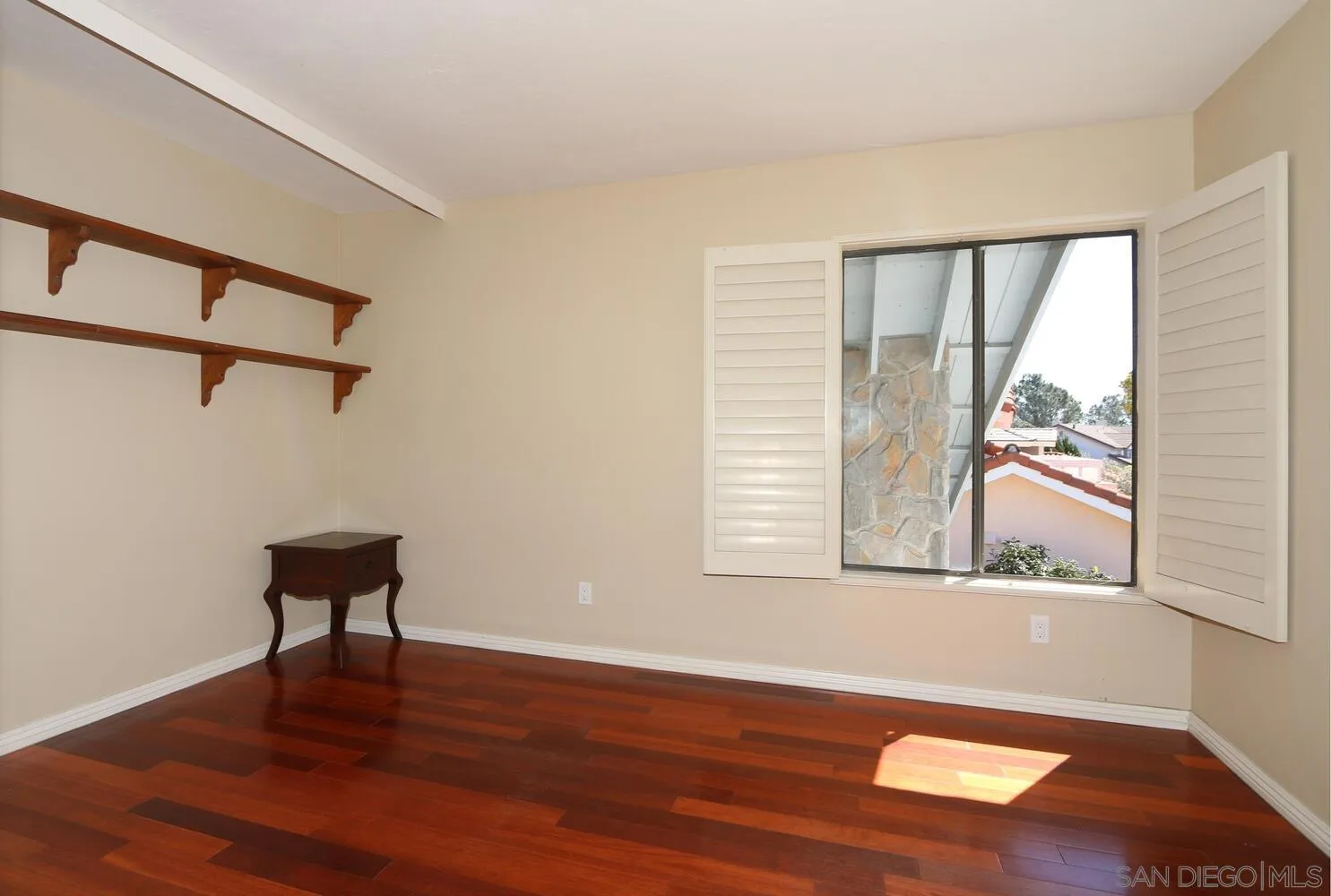 13375 Roxton Circle San Diego, CA 92130 - Photo 21 of 29 a view of a room with wooden floor and windows