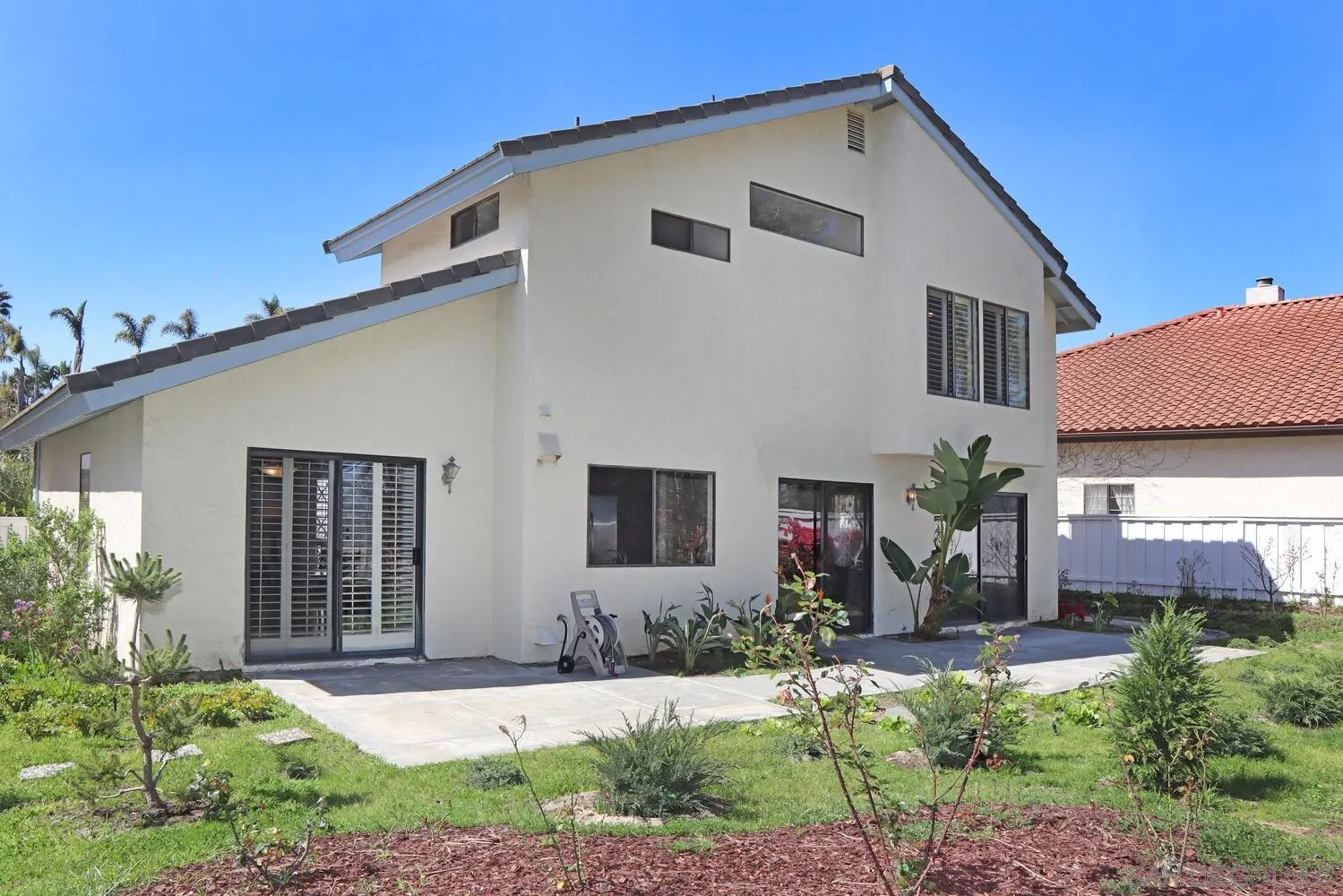 13375 Roxton Circle San Diego, CA 92130 - Photo 27 of 29 a view of a house with backyard and garden