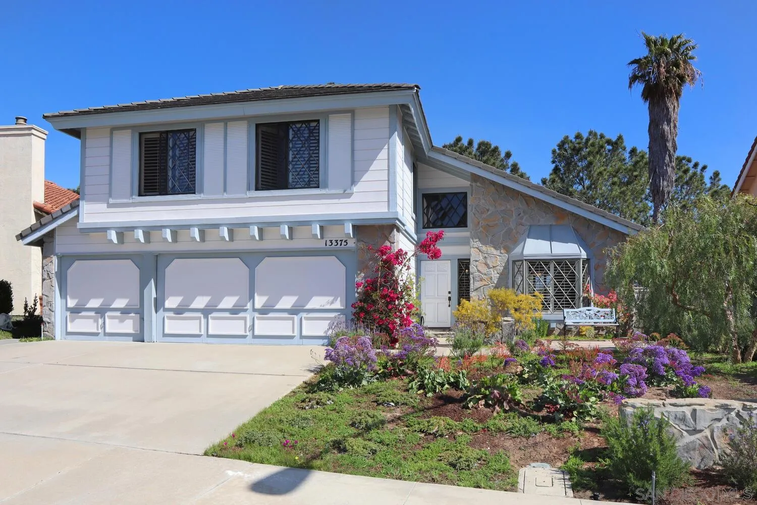 13375 Roxton Circle San Diego, CA 92130 - Photo 29 of 29 a front view of a house with plants