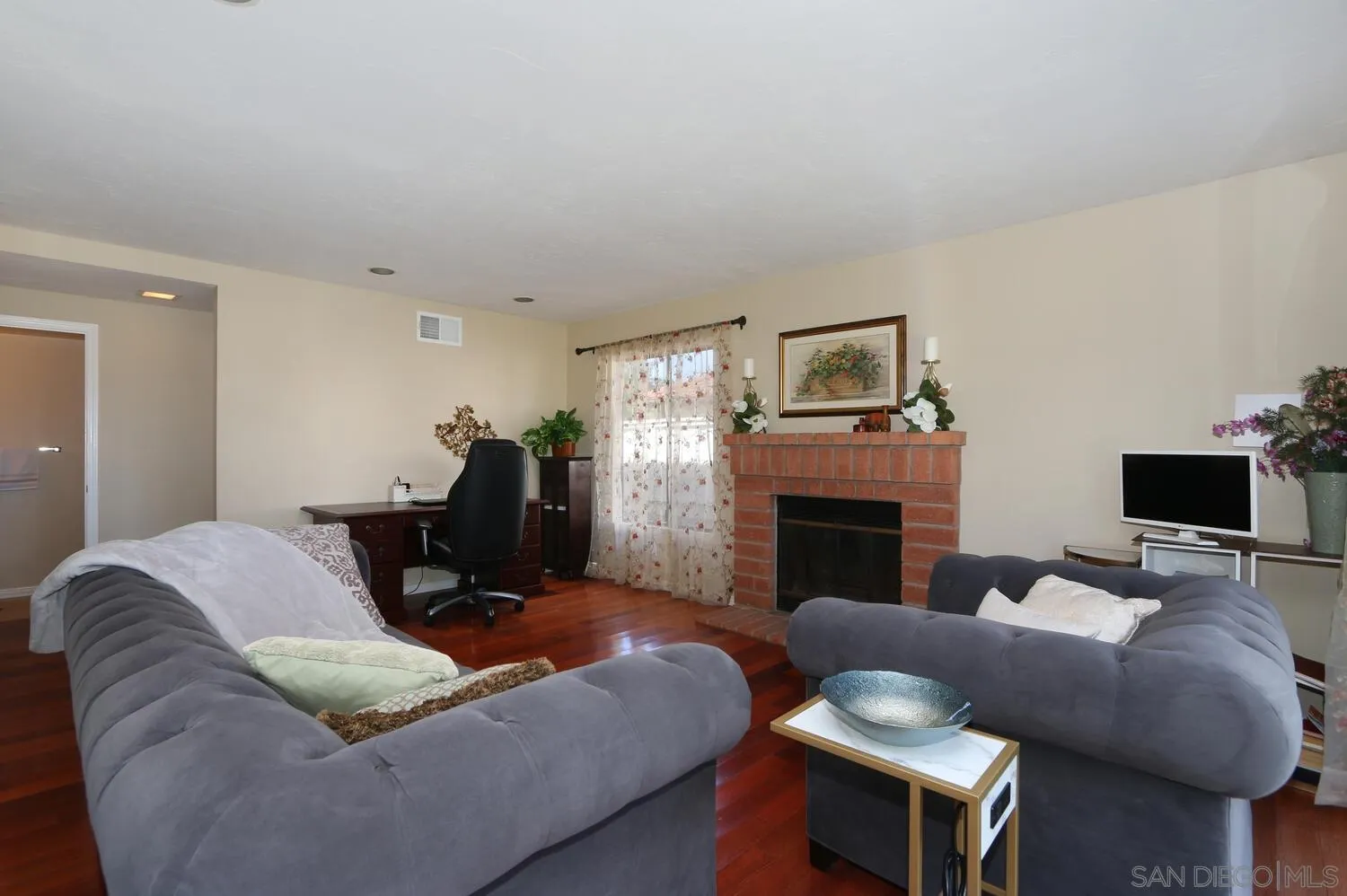 13375 Roxton Circle San Diego, CA 92130 - Photo 5 of 29 a living room with furniture and a fireplace
