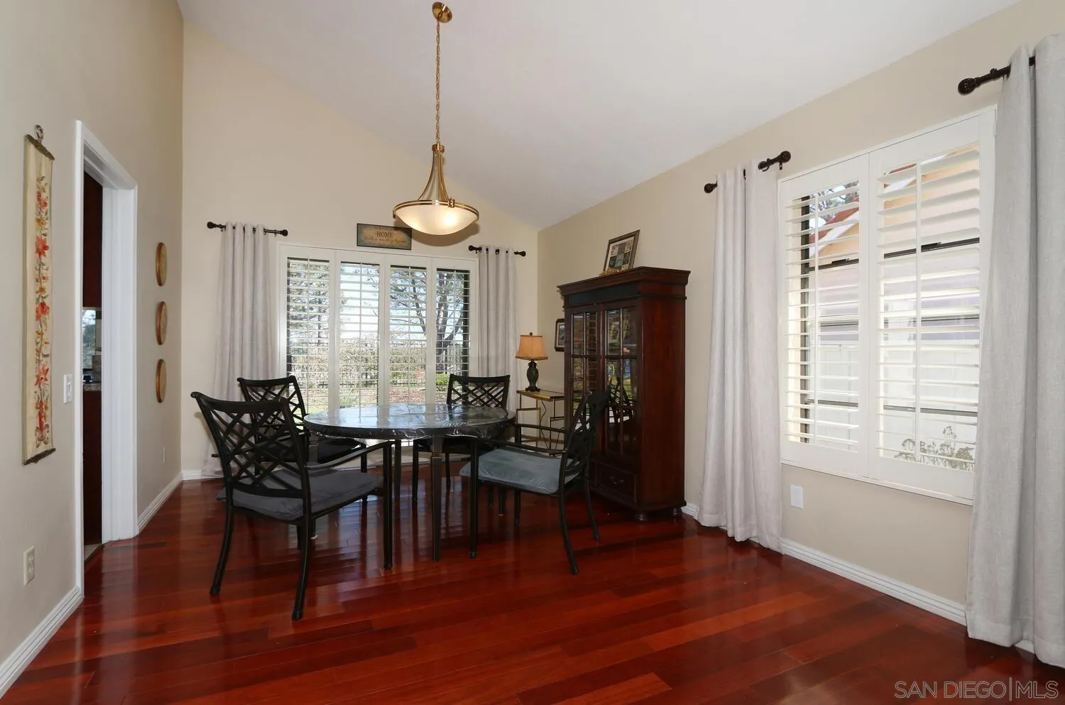 13375 Roxton Circle San Diego, CA 92130 - Photo 8 of 29 a view of a dining room with furniture window and wooden floor