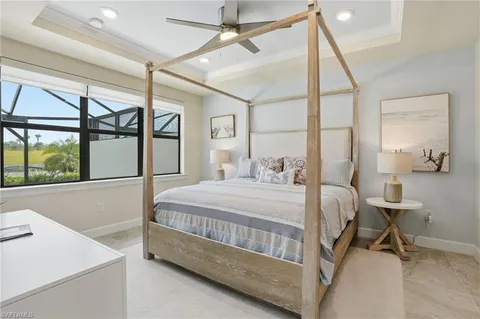 a bed room with a bed and a window