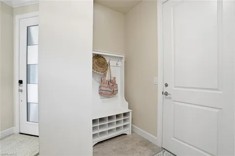 a view of a room with wall closet and windows