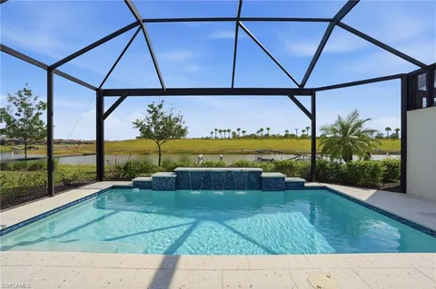 a view of a swimming pool with a patio