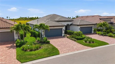 an aerial view of a house with a garden and pool