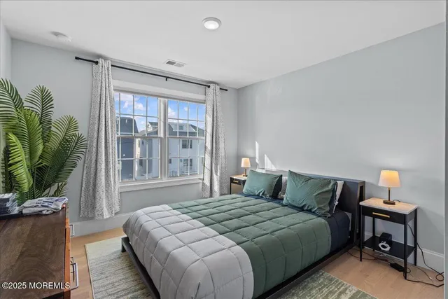 a bathroom with a granite countertop sink toilet a mirror and shower