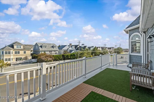 a bedroom with a large bed and a large window