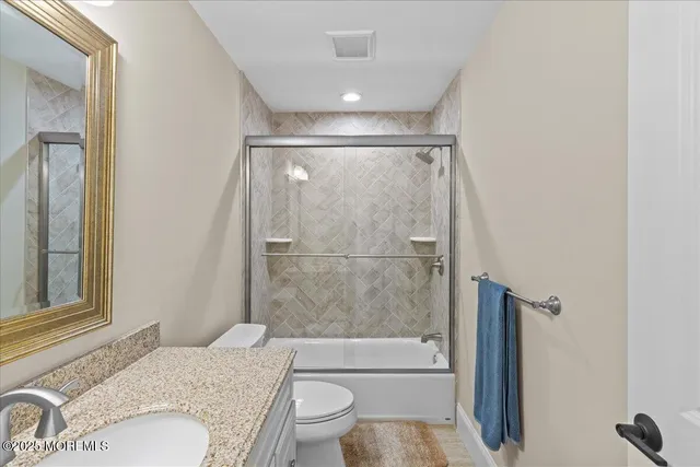 a bed room with a bed and a chair