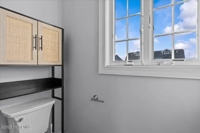 a bedroom with a bed and a night stand