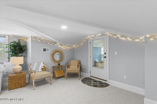 a bathroom with a granite countertop sink toilet a mirror and shower