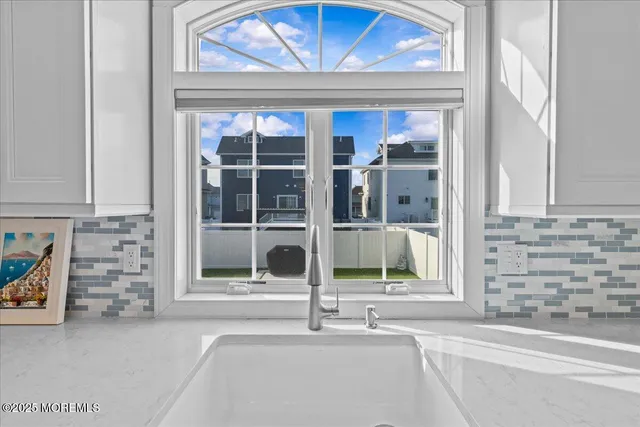 a bathroom with a sink and a window