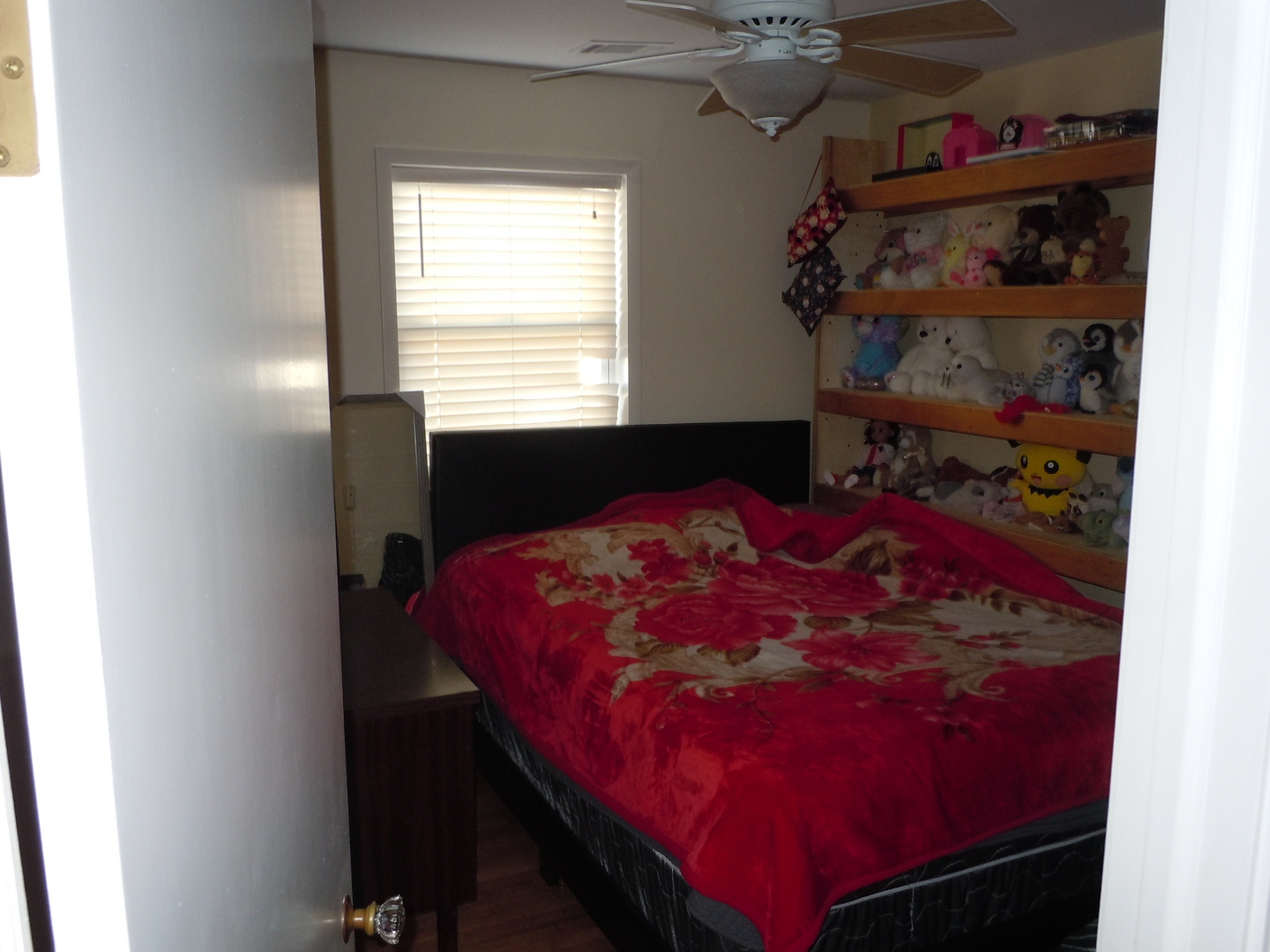 138 West Irving Park Road Wood Dale, IL 60191 - Photo 16 of 63 a bed sitting in a bedroom next to a window