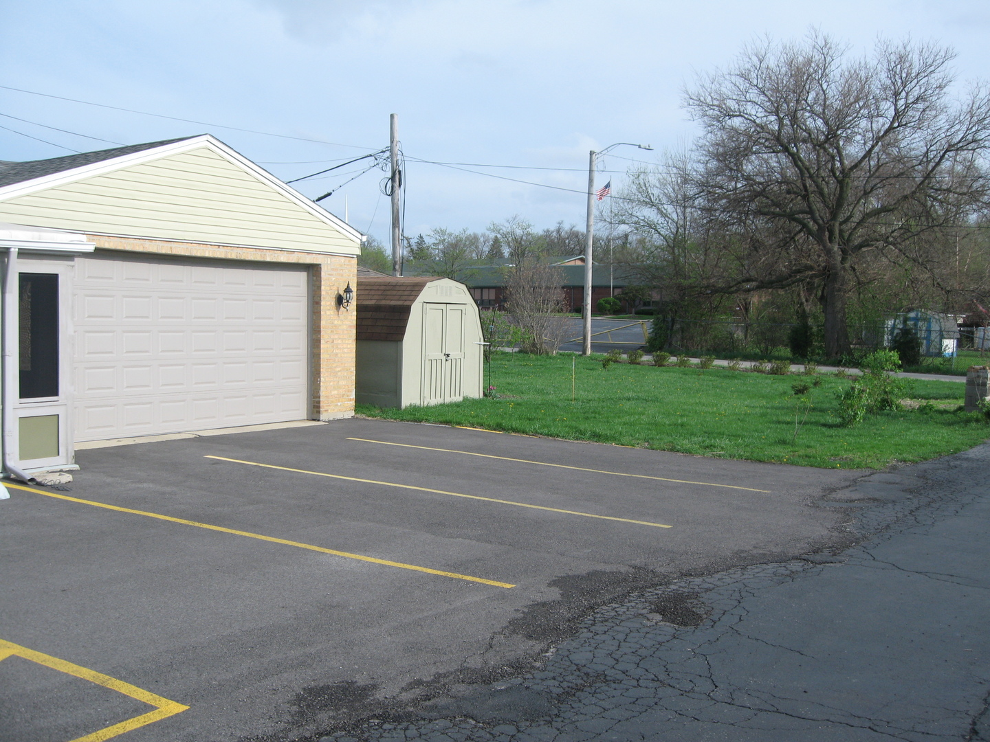 138 West Irving Park Road Wood Dale, IL 60191 - Photo 43 of 63 a view of a house with a yard and garage