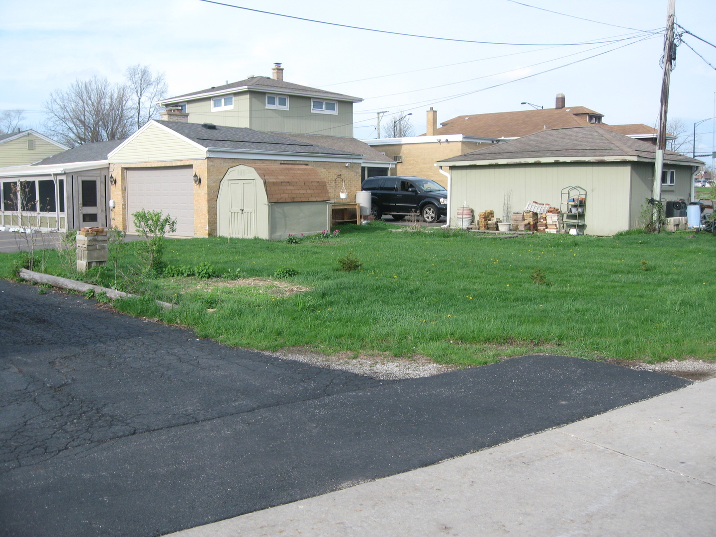 138 West Irving Park Road Wood Dale, IL 60191 - Photo 45 of 63 a front view of a house with a garden and yard