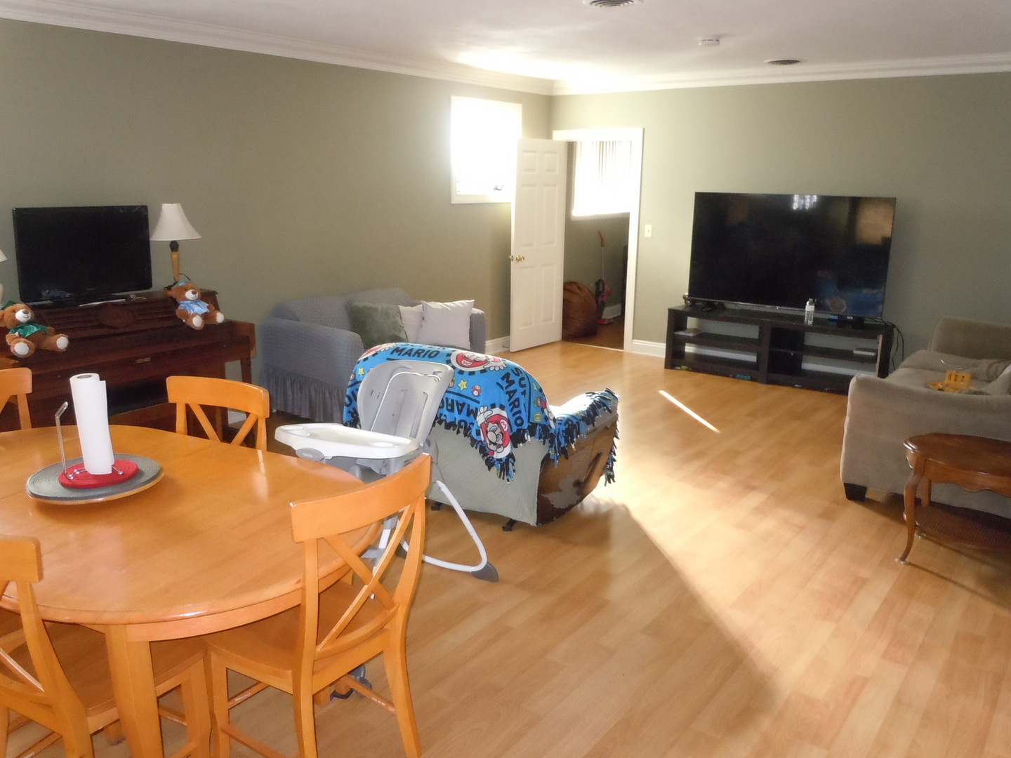 138 West Irving Park Road Wood Dale, IL 60191 - Photo 6 of 63 a living room with furniture and a flat screen tv