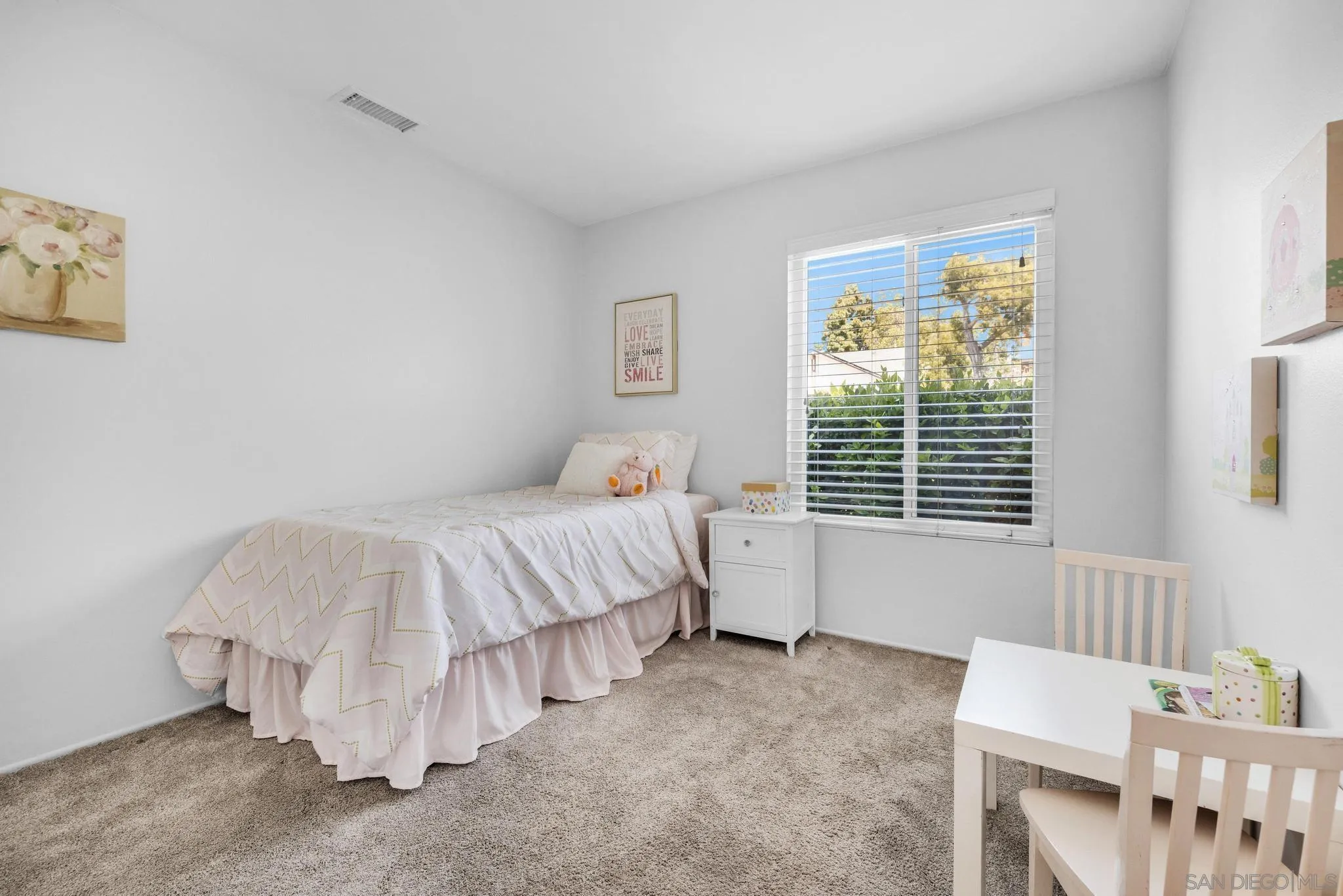 1841 Gatepost Road Encinitas, CA 92024 - Photo 14 of 30 a bedroom with a bed and a table in it