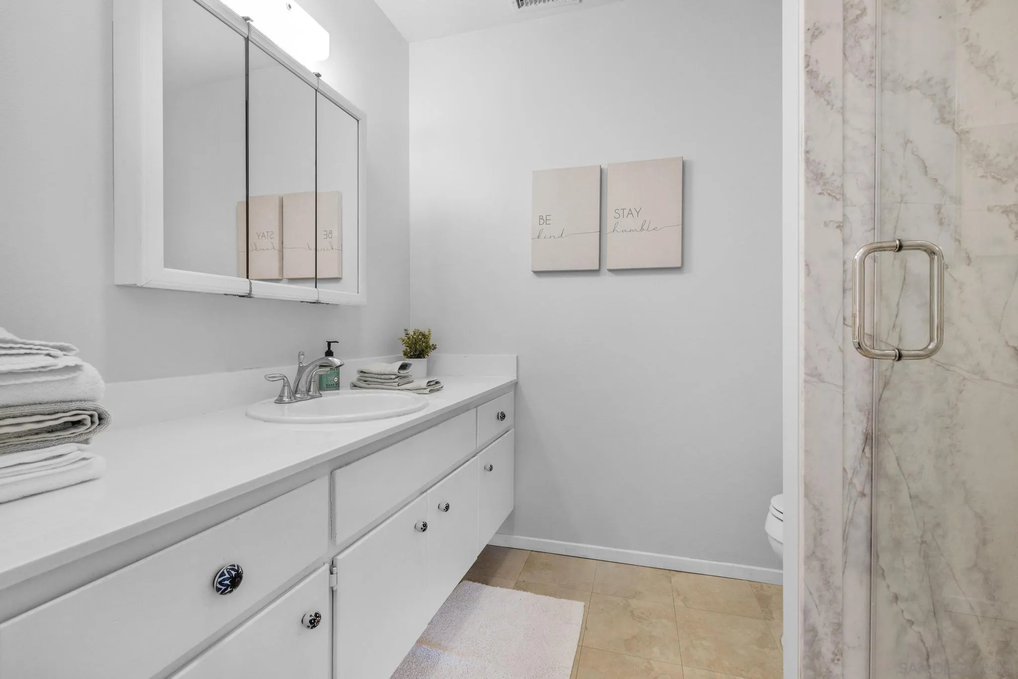 1841 Gatepost Road Encinitas, CA 92024 - Photo 17 of 30 a bathroom with a sink and vanity