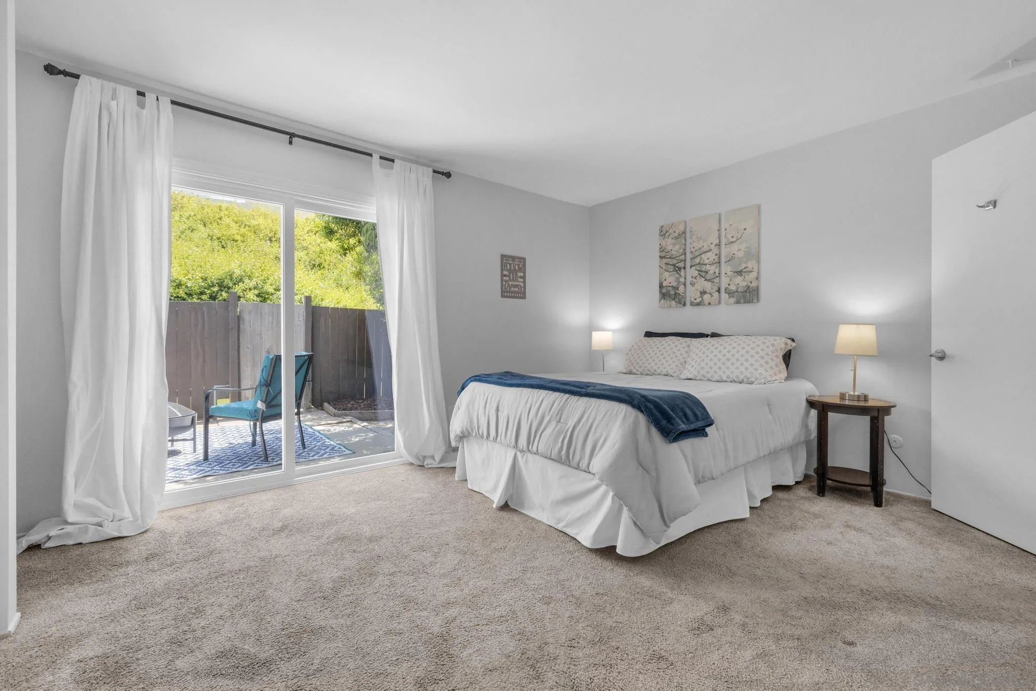1841 Gatepost Road Encinitas, CA 92024 - Photo 19 of 30 a spacious bedroom with a bed and a large window