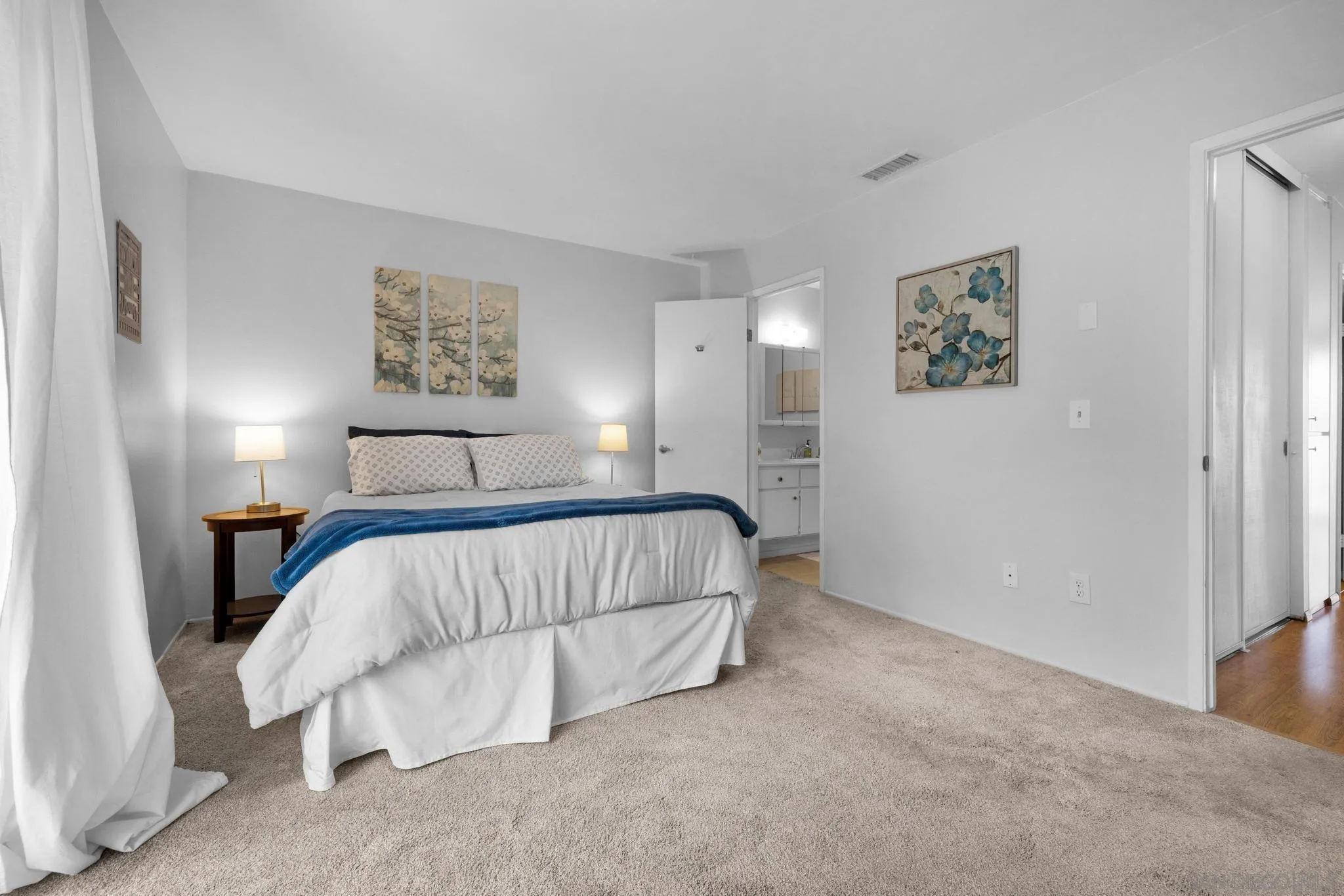 1841 Gatepost Road Encinitas, CA 92024 - Photo 20 of 30 a bed room with a bed and a painting on the wall