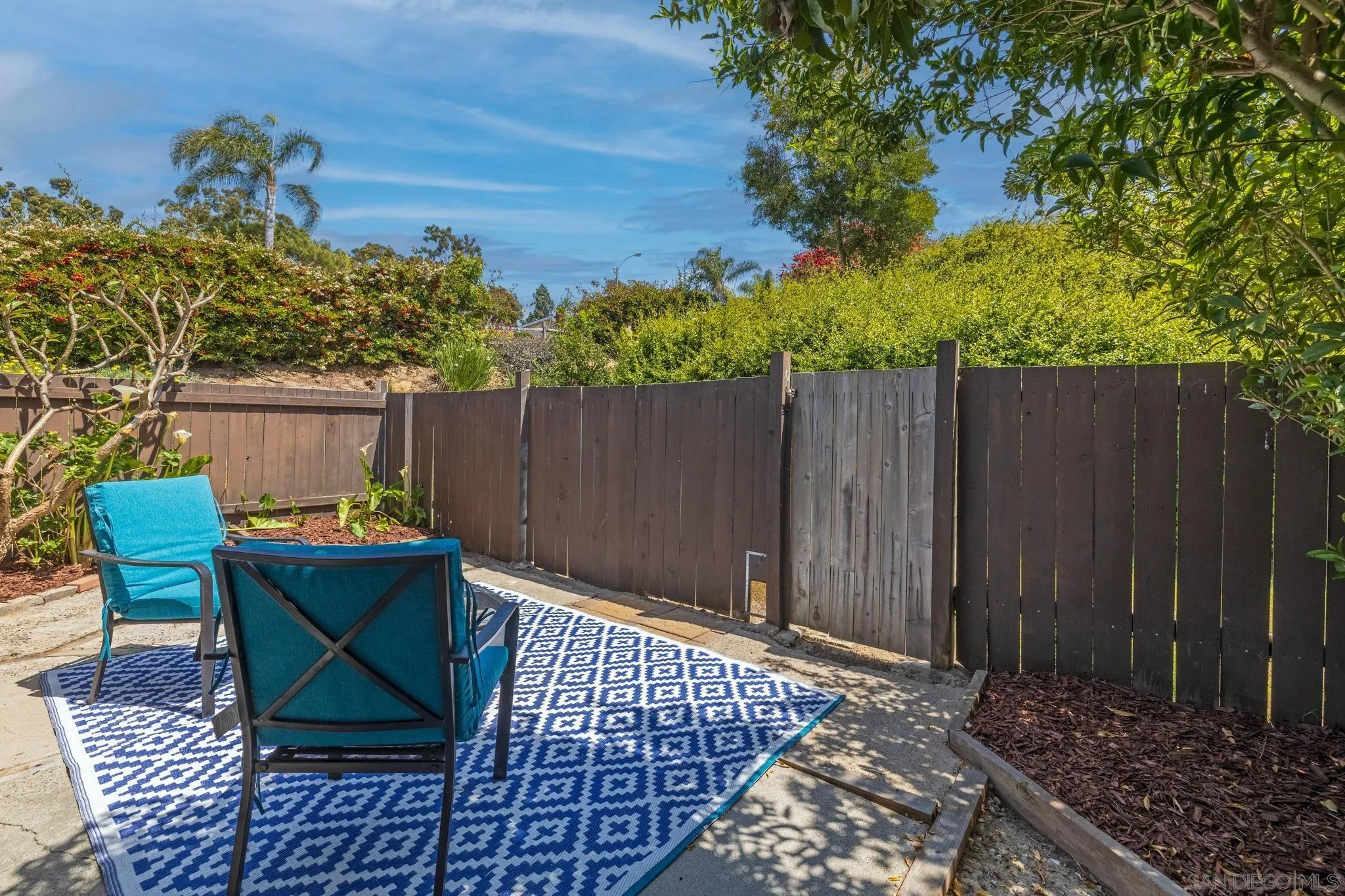 1841 Gatepost Road Encinitas, CA 92024 - Photo 24 of 30 a backyard of a house with table and chairs