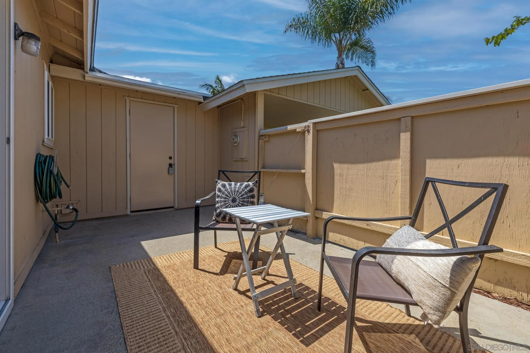 1841 Gatepost Road Encinitas, CA 92024 - Photo 26 of 30 a patio with a table and chairs