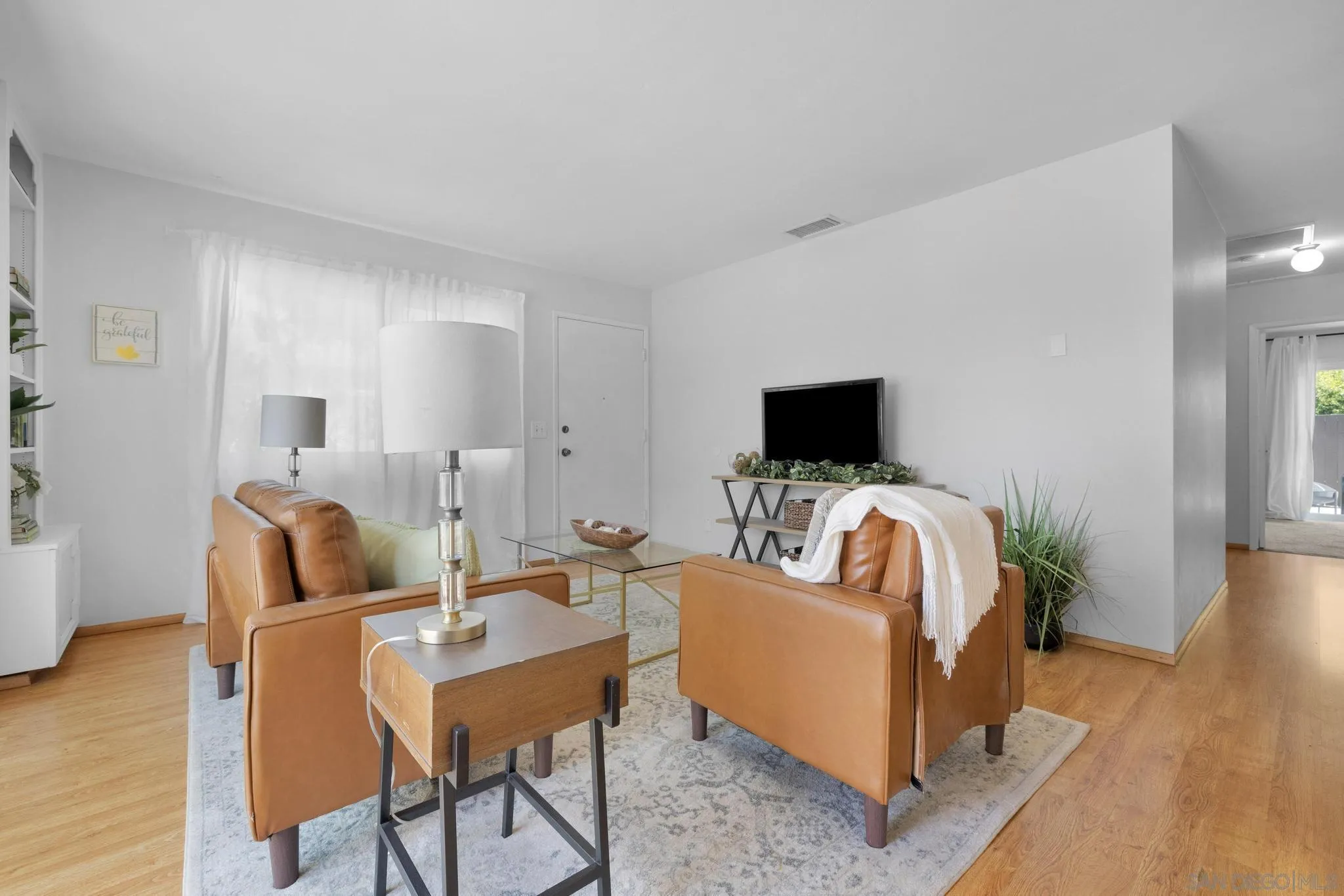 1841 Gatepost Road Encinitas, CA 92024 - Photo 6 of 30 a living room with furniture and a flat screen tv