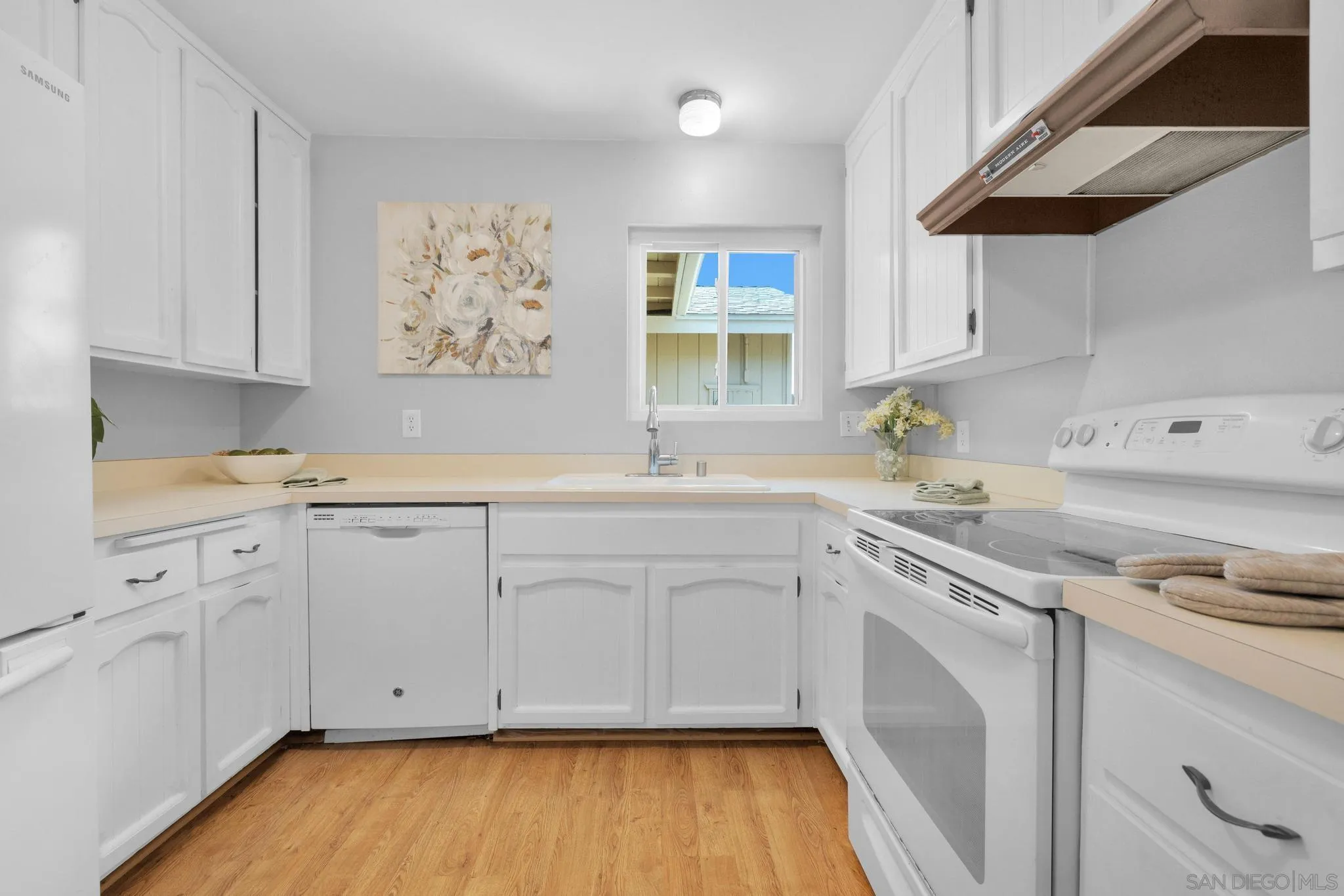 1841 Gatepost Road Encinitas, CA 92024 - Photo 10 of 30 a kitchen with cabinets a sink and appliances