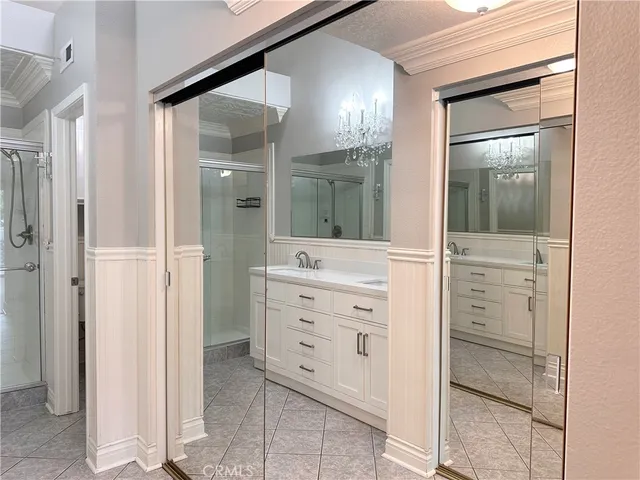 a living room with a fireplace and wooden floor