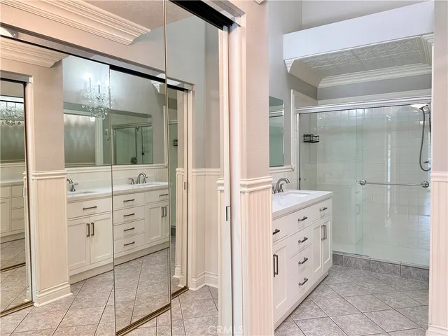 a view of hallway with stairs and wooden floor