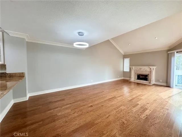 en empty room with windows and fan