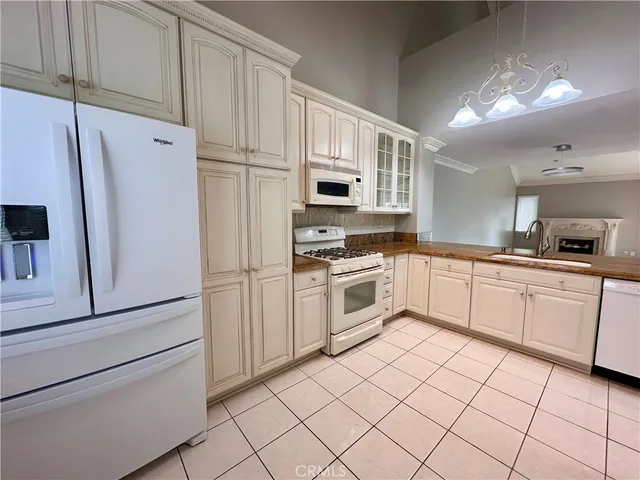 a view of an empty room and fire place