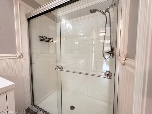 a view of empty room with wooden floor and fireplace