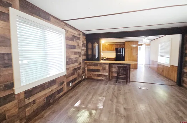 a view of a room with furniture and a window