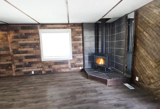 a room with a fireplace and a window