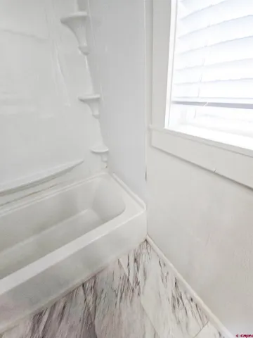 a bathroom with a bathtub