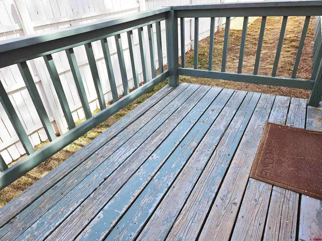 a view of balcony with wooden floor