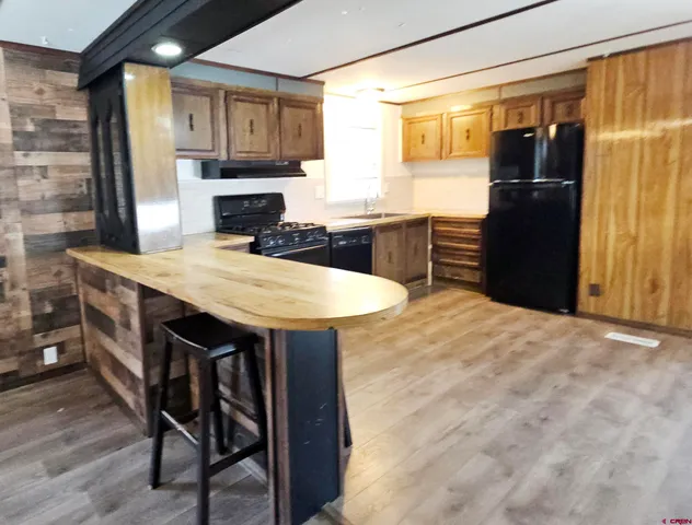 a kitchen with a table and refrigerator