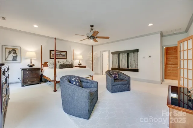 a bathroom with a double vanity sink a large mirror and a bathtub