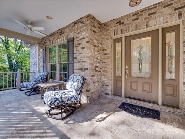 a kitchen with kitchen island granite countertop stove top oven and cabinets