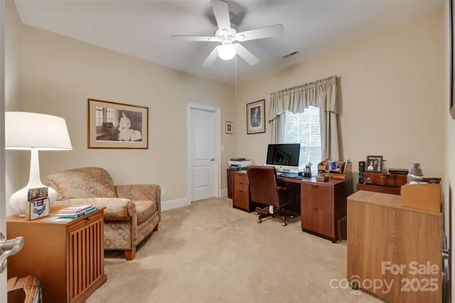 a bathroom with a granite countertop sink a toilet and a mirror