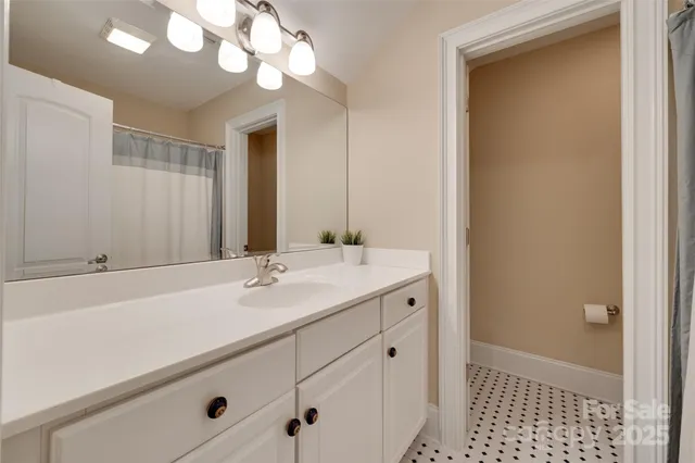 a view of walk in closet with clothes