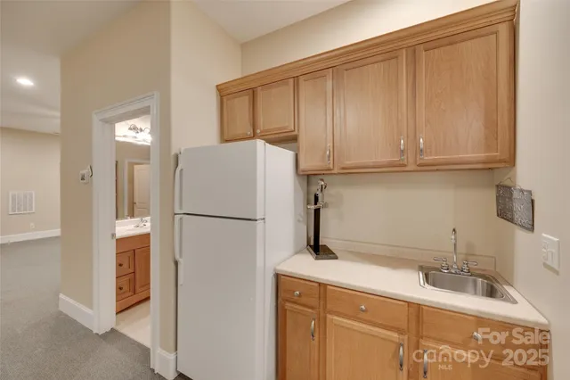 a bathroom with a double vanity sink mirror and shower
