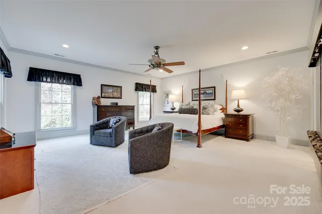 a living room with furniture and a book shelf